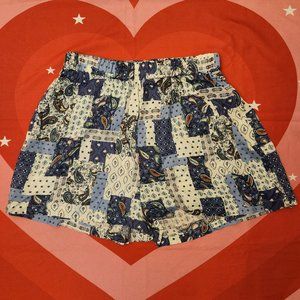 paisley patterned blue and white patchwork print shorts